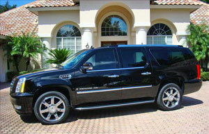 A black suv parked in front of a house.